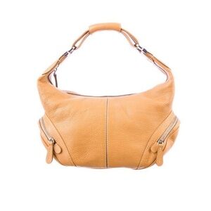 Tod’s Butterscotch Colored Pebbled Leather Hobo Bag.